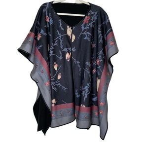 Black floral flannel poncho with snap closure. 2Xl